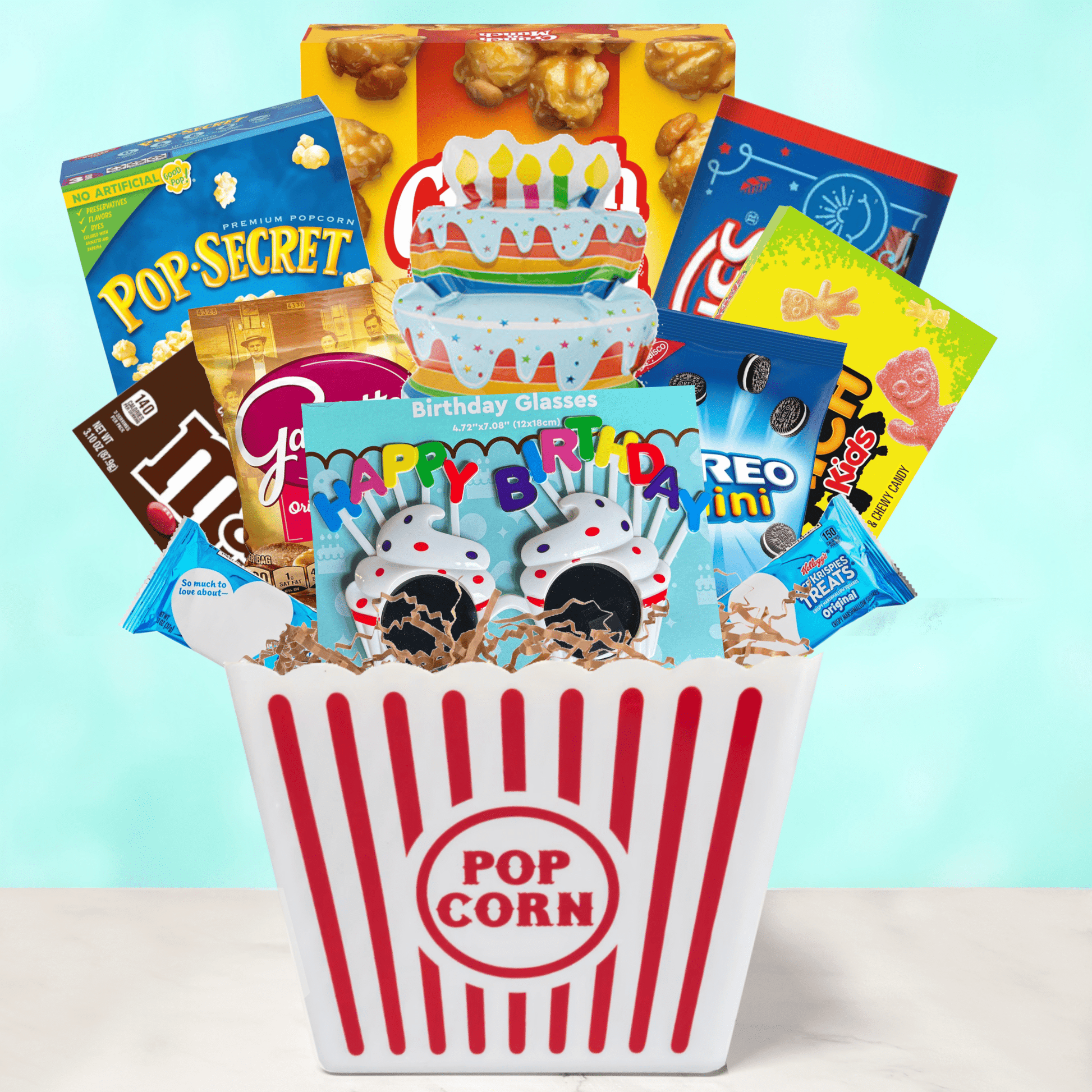 Birthday Movie Night Gift Bucket with popcorn, candy, and balloon