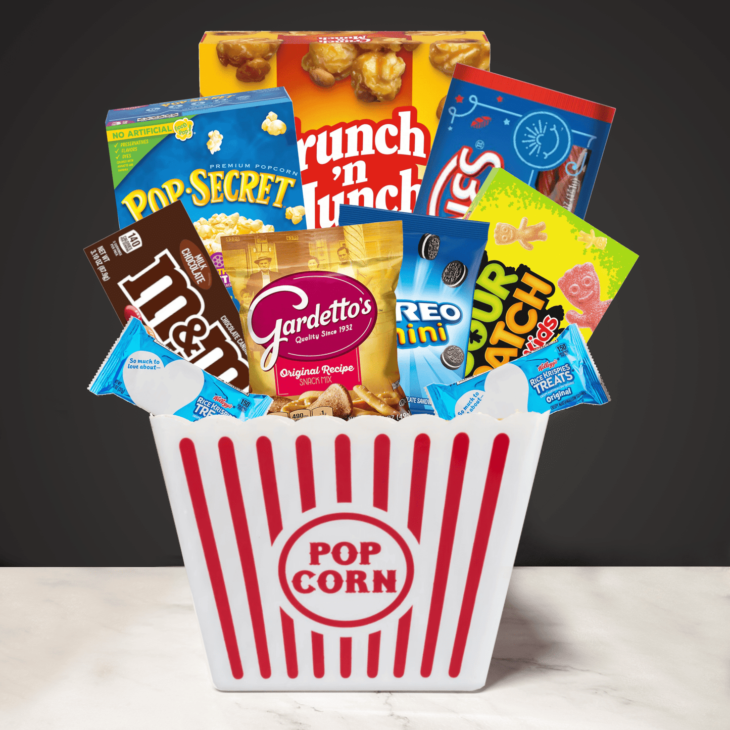 Filled Movie Night Popcorn Bucket with popcorn, candy, and snacks